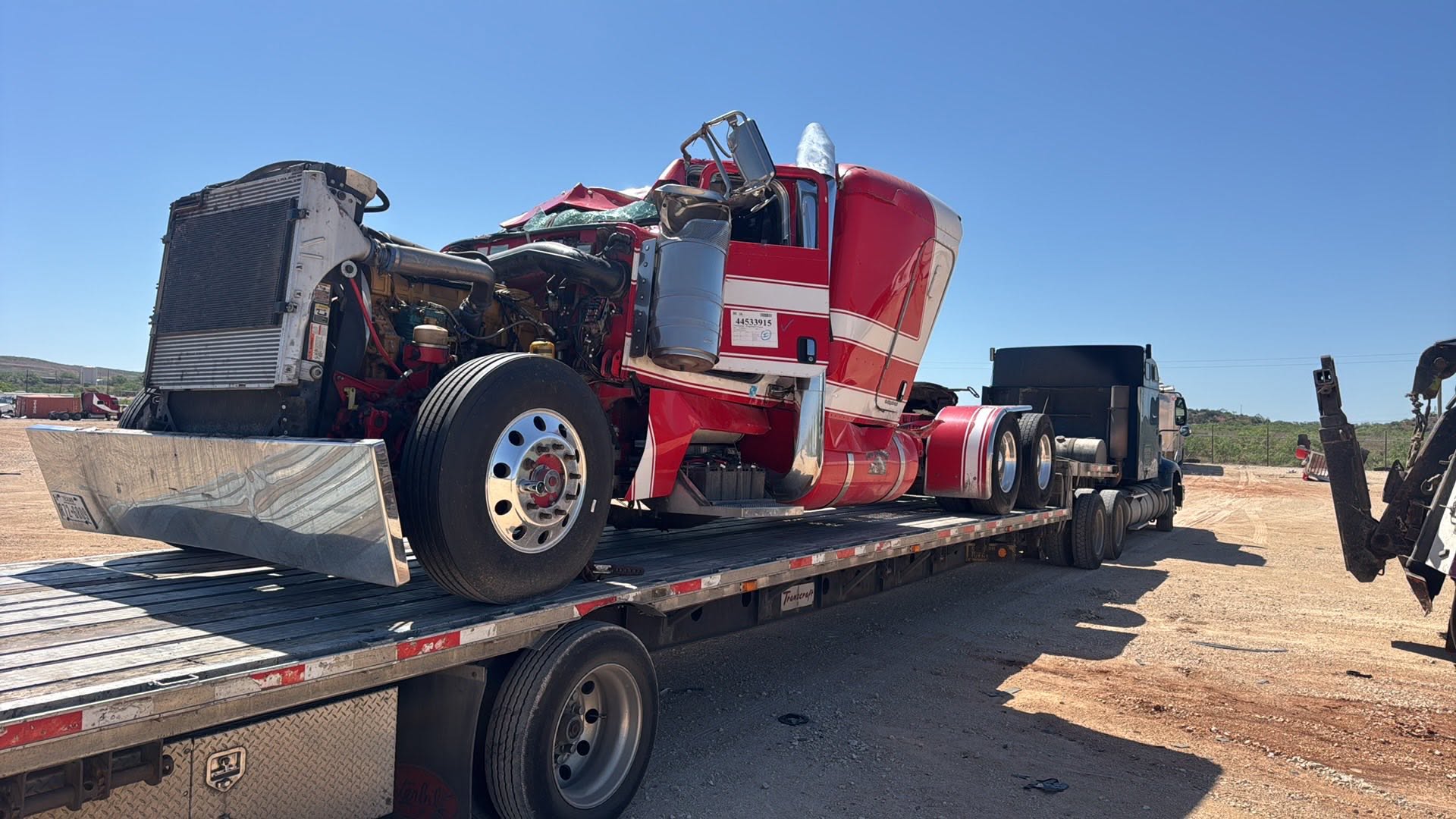 O'Bar flatbed carrying a semi tractor
