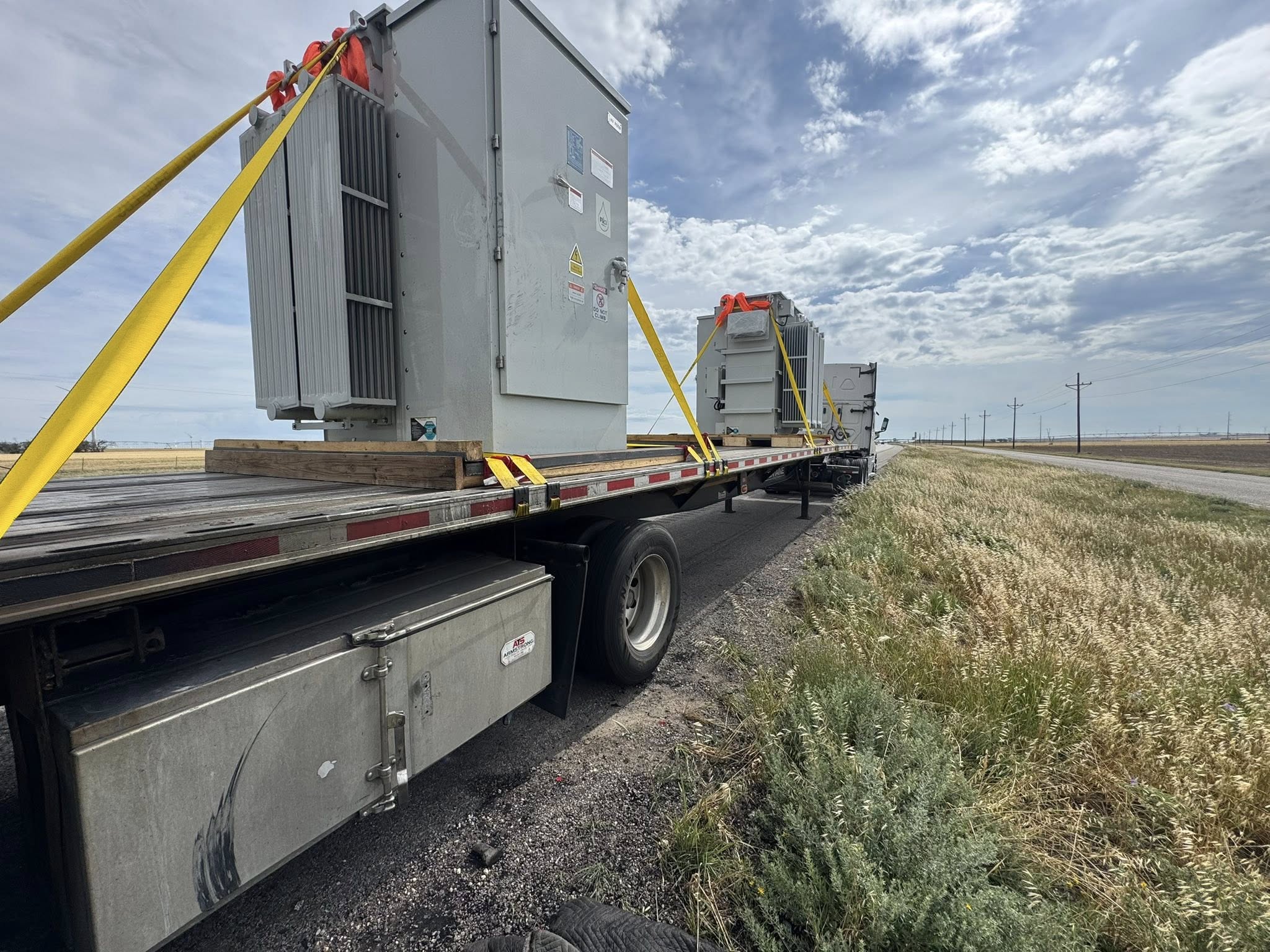 O'Bar hauling equipment on a rural road